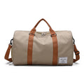 Sac sac de sport beige en nylon avec anses marron, compartiment chaussures et bandoulière amovible pour voyage