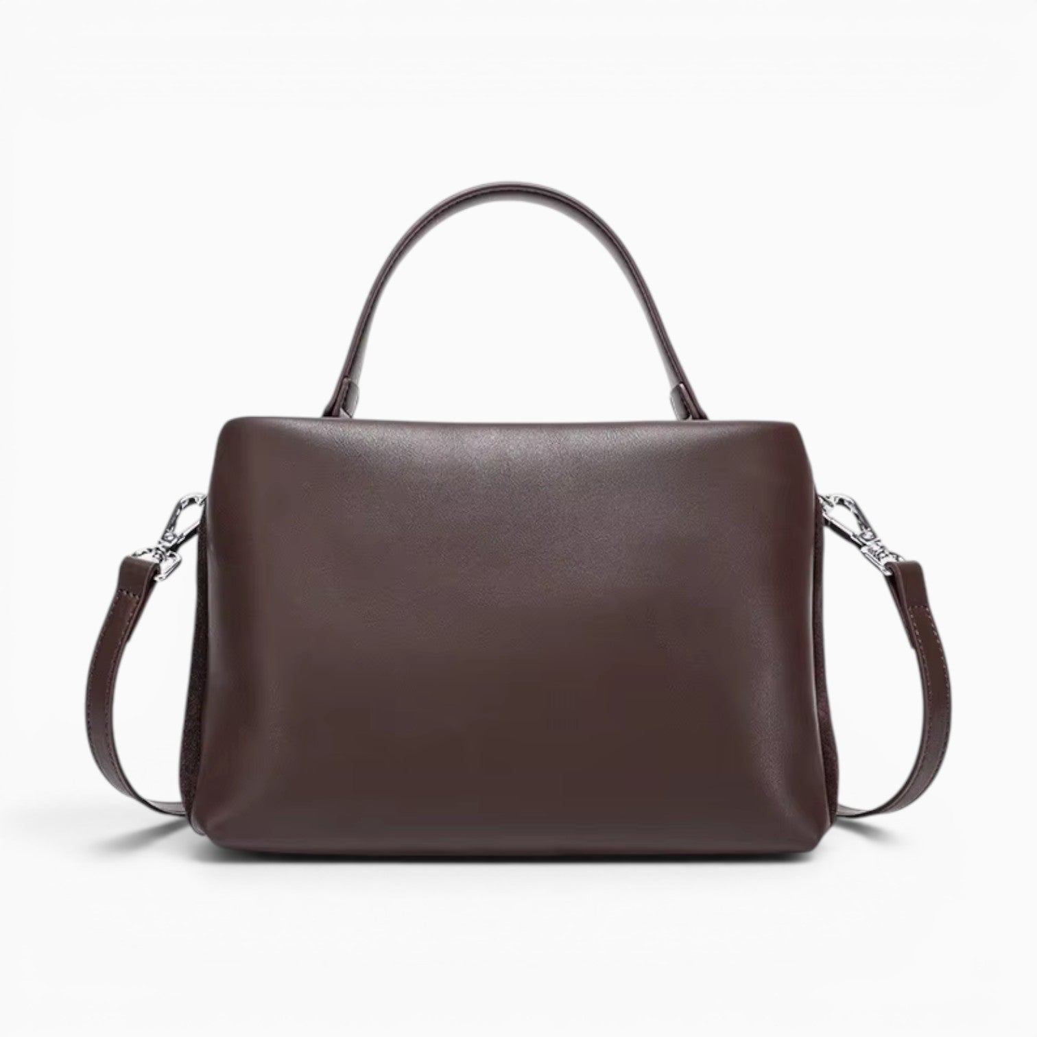 Sac marron en cuir véritable avec poignée supérieure et bandoulière amovible, style vintage élégant.